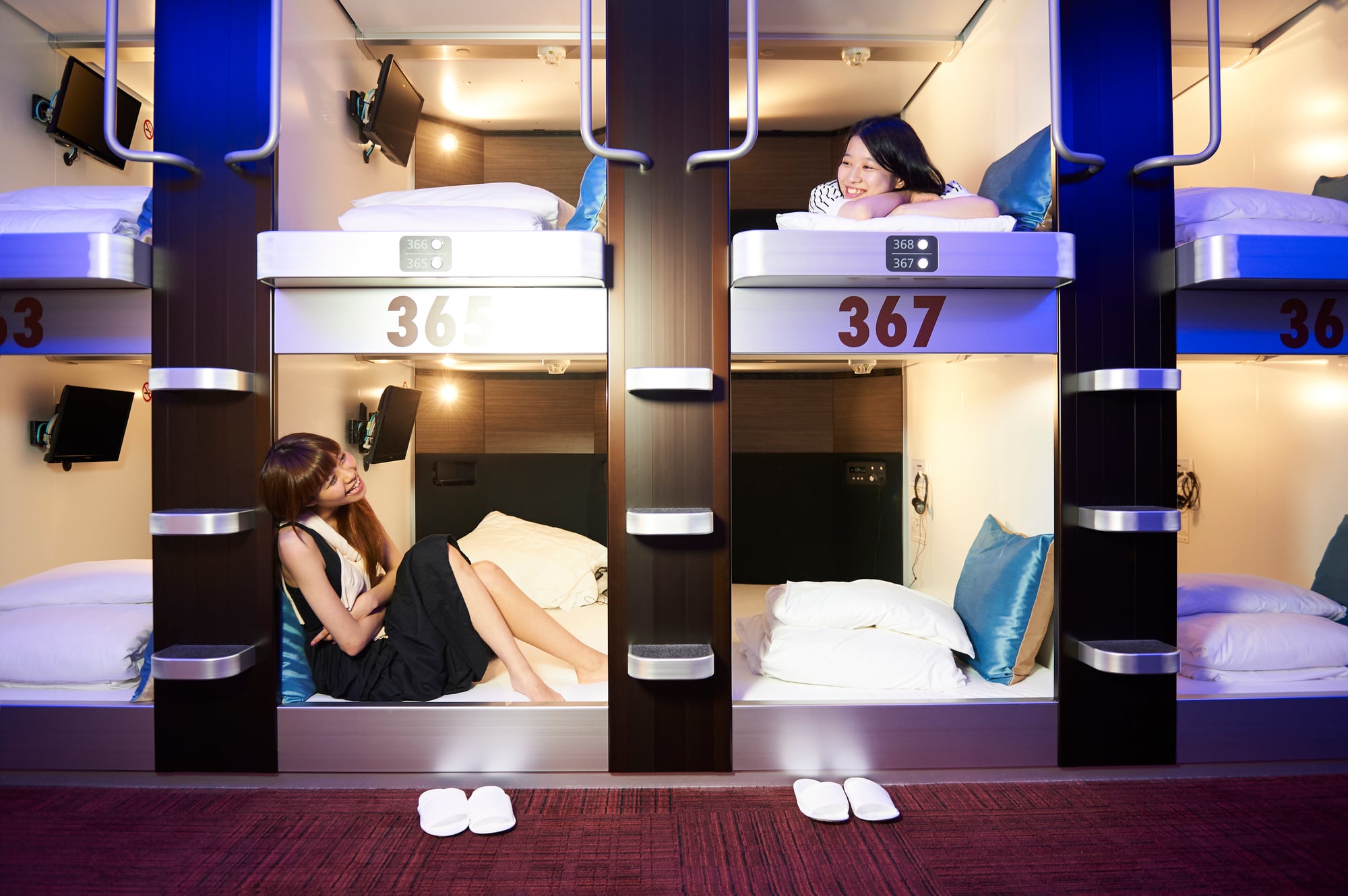 Two women in capsule hotel